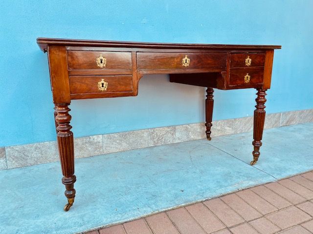 Mahogany and mahogany feather desk with side extensions, has burgundy leather top in excellent condition.
