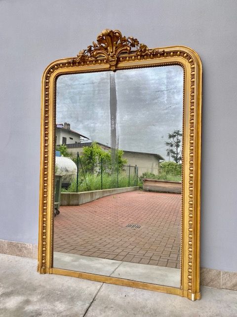 Large Mirror with Cimasa, in Carved and Leaf-Gilded Wood.