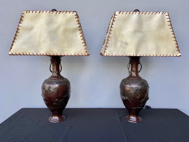 Pair of Japanese Lamp-mounted Bronze Vases, featuring relief figures of birds and landscape.