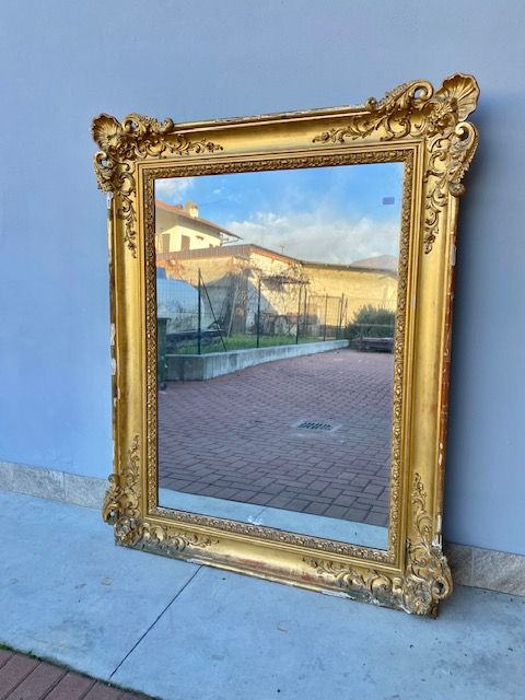 Large Charles X mirror in wood and gilded leaf pastille.