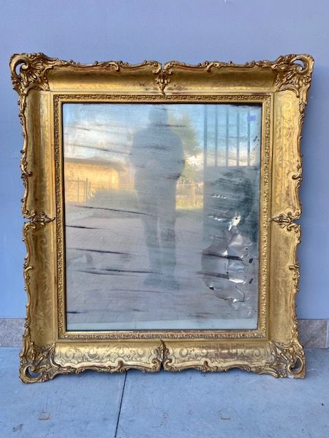 Charles X mirror in wood and gilded leaf pastille.