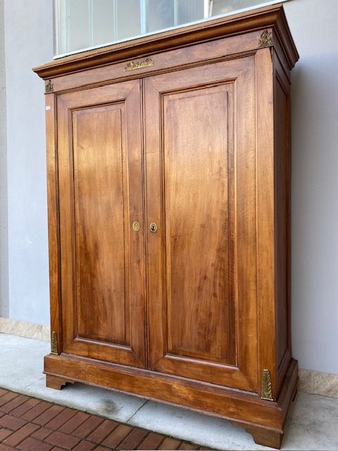 Elegant Empire Wardrobe in Walnut, features original bronzes.