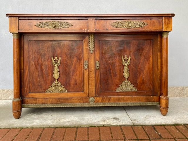 Important Empire Sideboard in Mahogany, featuring original bronze applications.