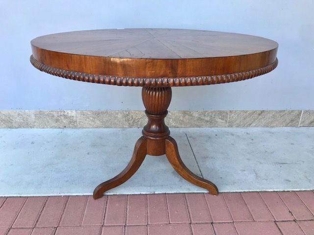 Carlo X veneered walnut round coffee table.